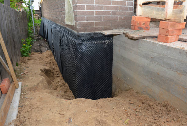 Happy homeowners after waterproofing job in Pretty Prairie